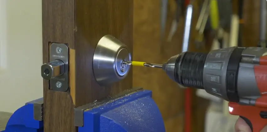 Commercial door lock being repaired