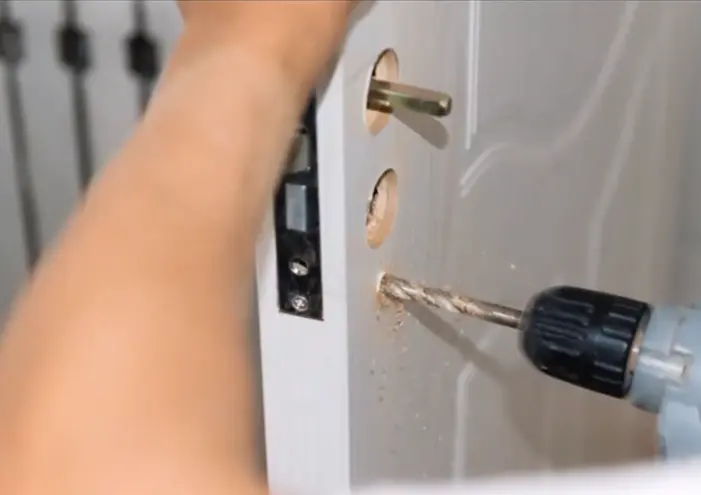 Locksmith changing a door lock in Bellmead, TX